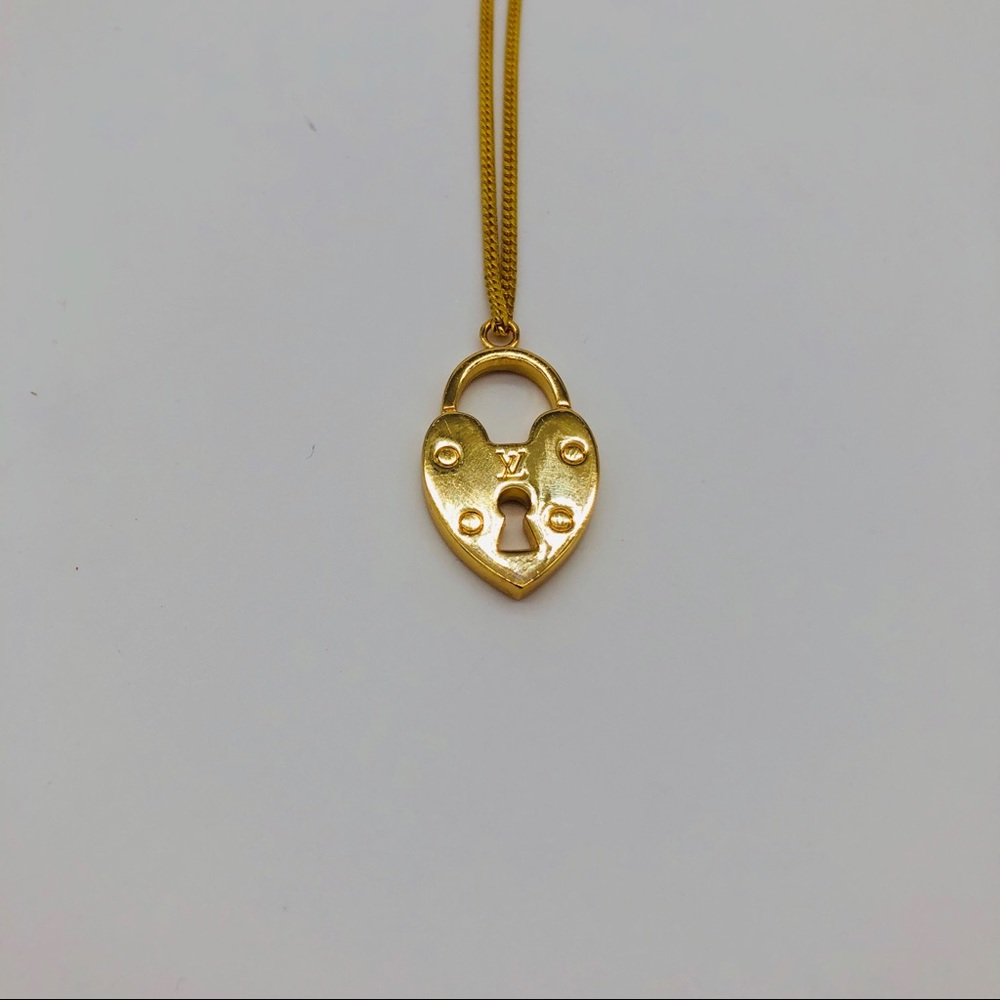 Necklace charm with gold plated chain.
